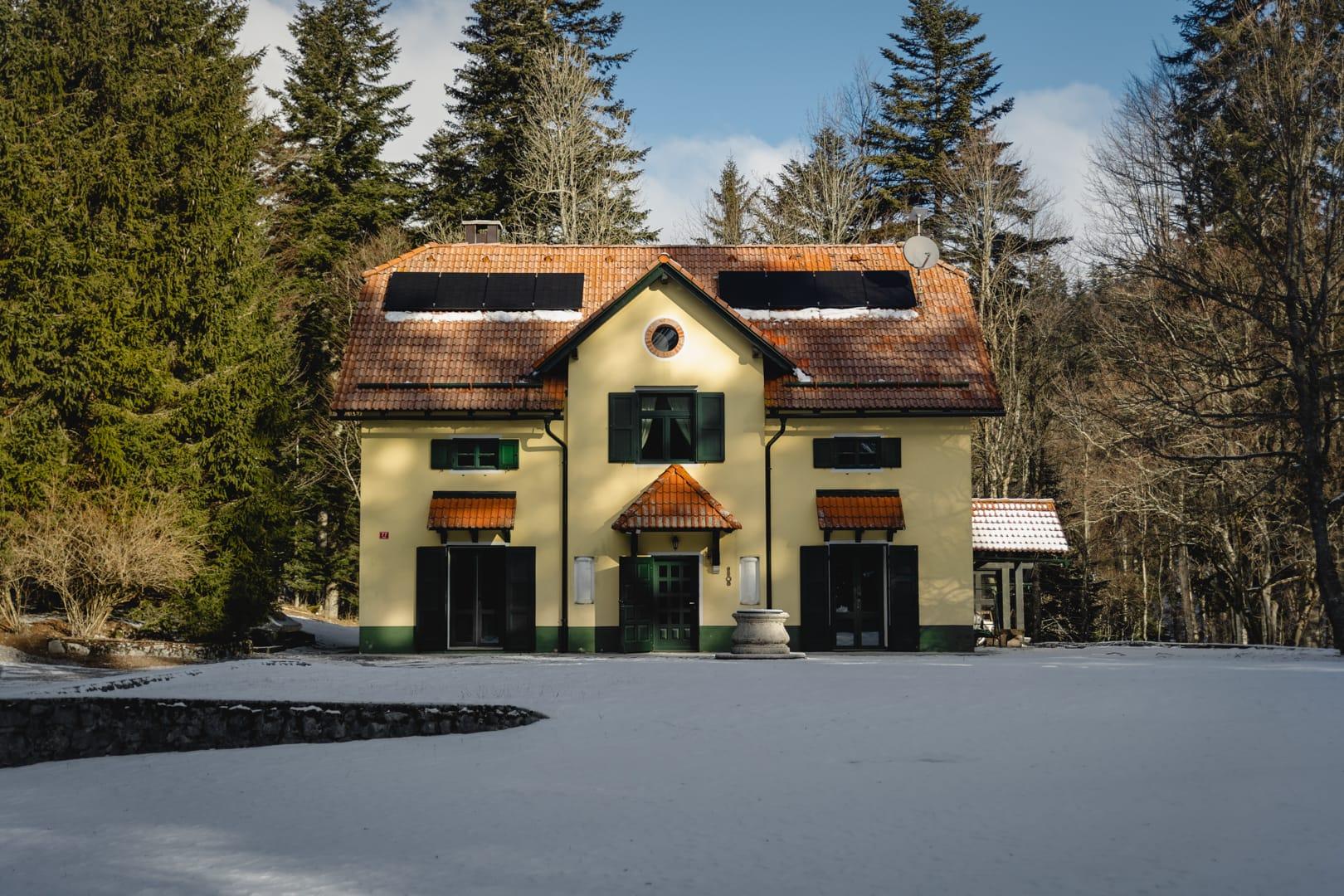 House under Javorniki background