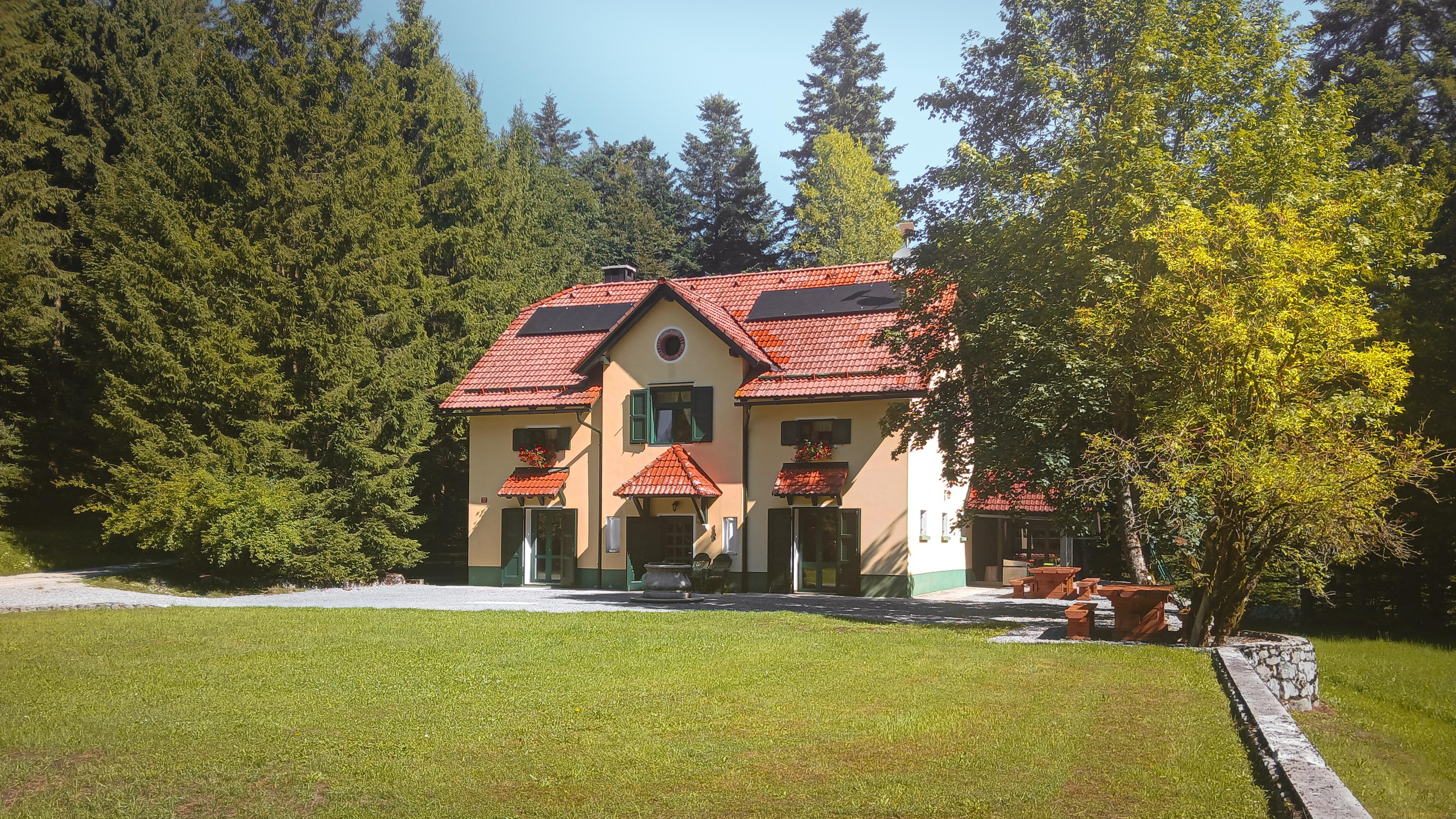 House under Javorniki background